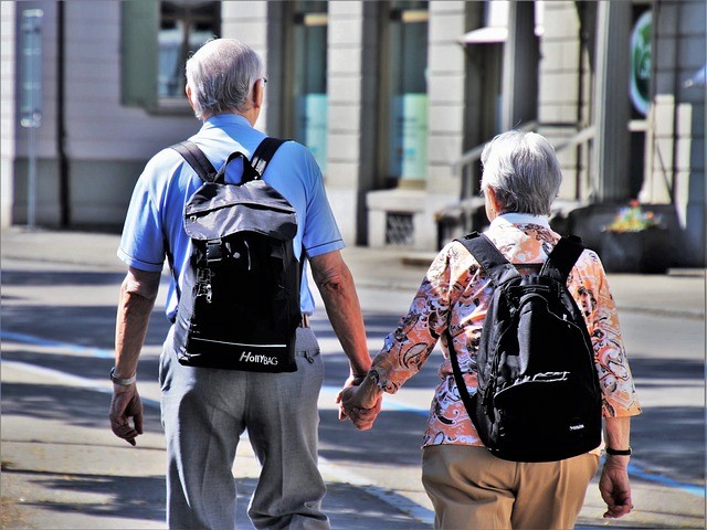 couple holding hands in street